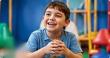 Smiling boy in a colourful therapy room
